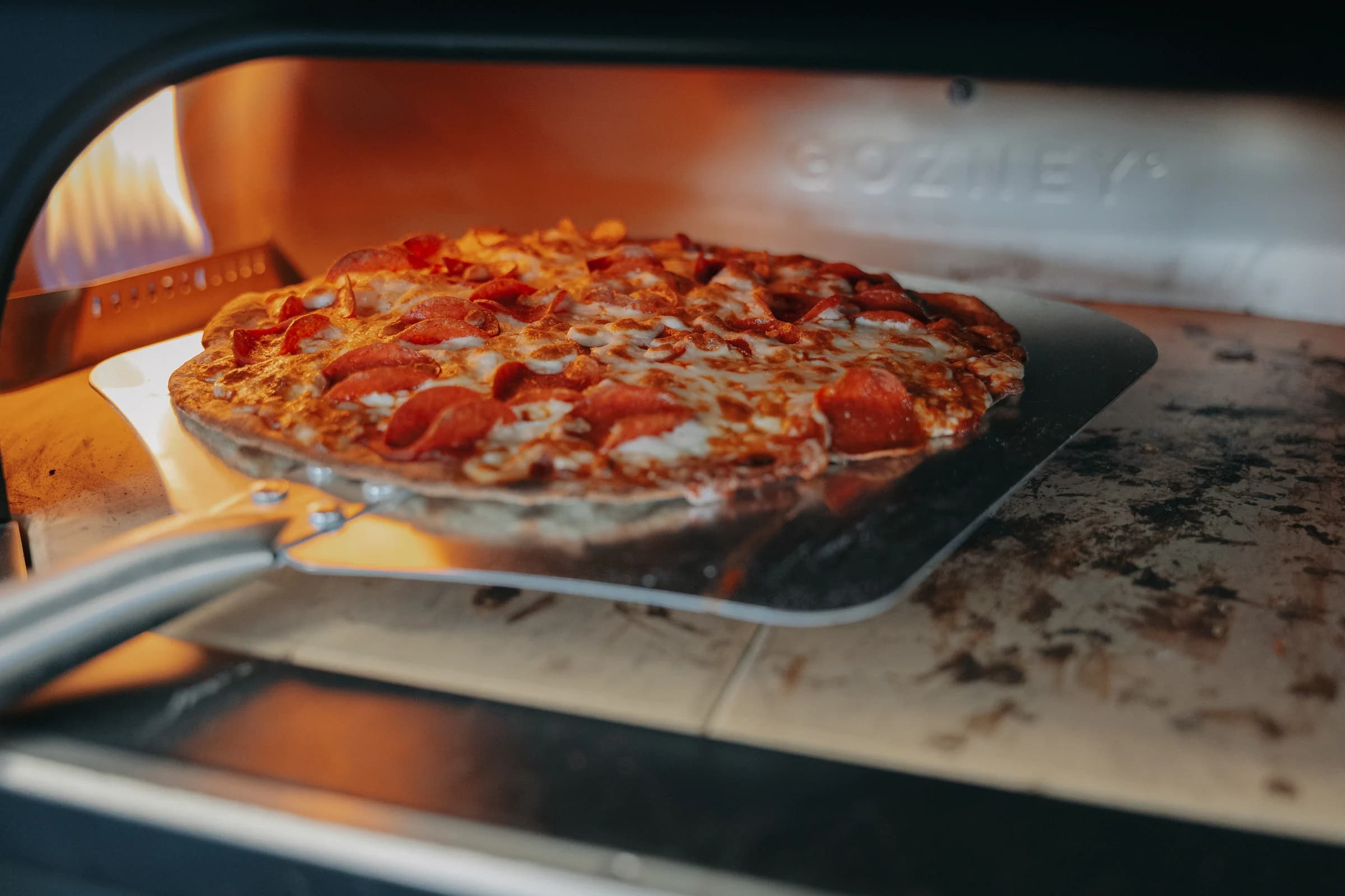 Pepperoni pizza baking in the Popular Pizza oven