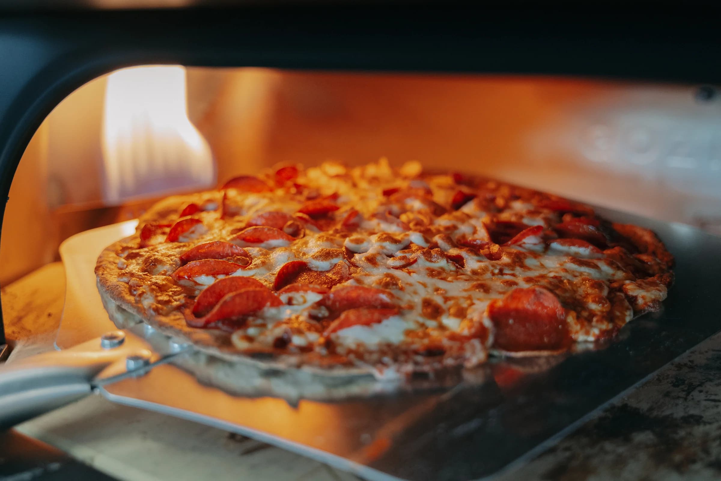 Pepperoni pizza baking in the Popular Pizza oven